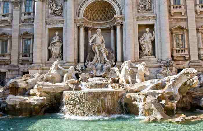 What takes place to coins that are thrown into the Trevi Fountain?